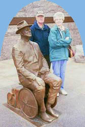 My parents with a statue of FDR in his wheelchair.